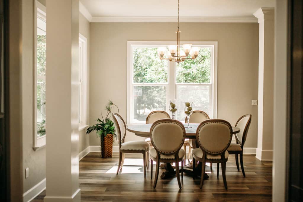 dining room with table and chairs in front of sunny window