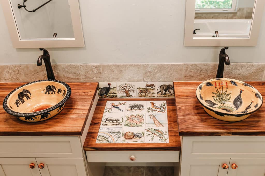 An example of a McFall bathroom renovation. It's his and hers sinks that are outlaid with animals. 