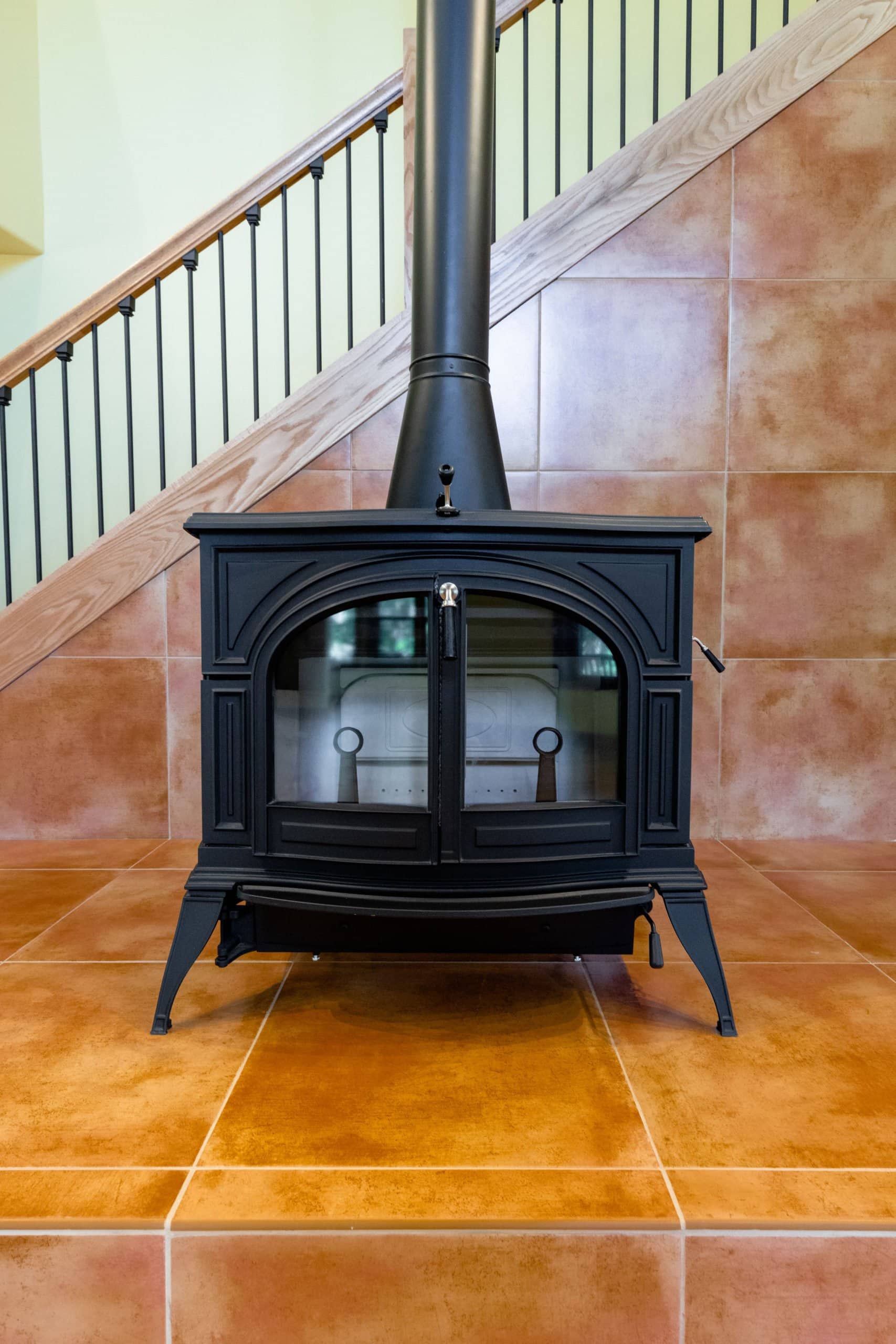 Interior home renovation - Fire place with tile and staircase in the background