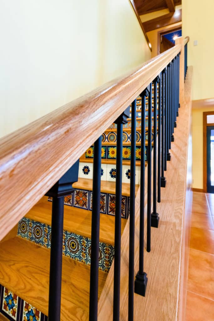 Interior home renovation - Staircase with railing and decorative steps.